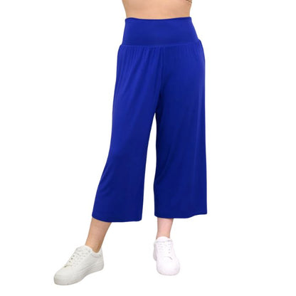 female model wearing violet purple gaylene capri pants front view on white background