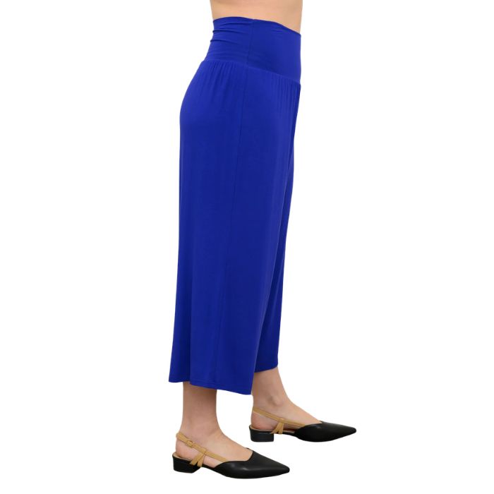 female model wearing violet purple gaylene capri pants side view on white background