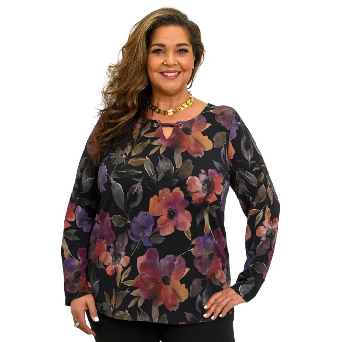 a woman wearing pink petals print gemi top wast up front view on white background