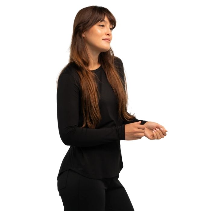 female model wearing black georgia crew top side view on white background