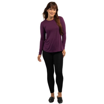 female model wearing italian plum purple georgia top and black suri leggings front view on white background