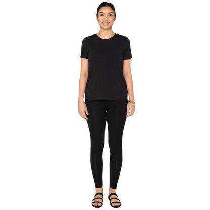 top of female model wearing black gracie crew neck t-shirt and black terry leggings front view on white background