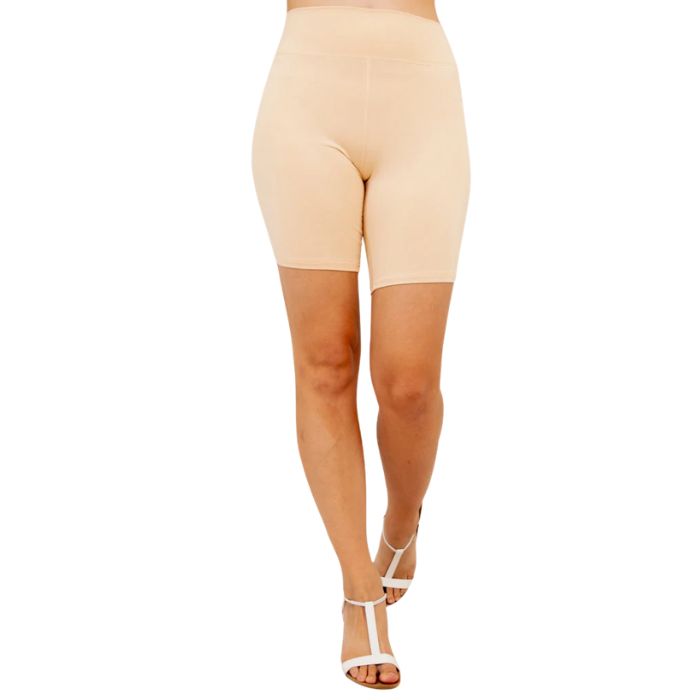 female model wearing beige brown hallie shorts front view on white background