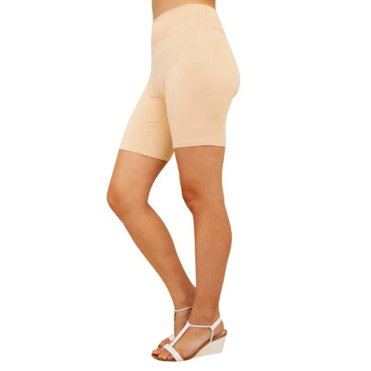 female model wearing beige brown hallie shorts side view on white background