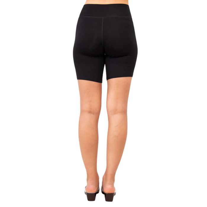 female model wearing black hallie shorts back view on white background