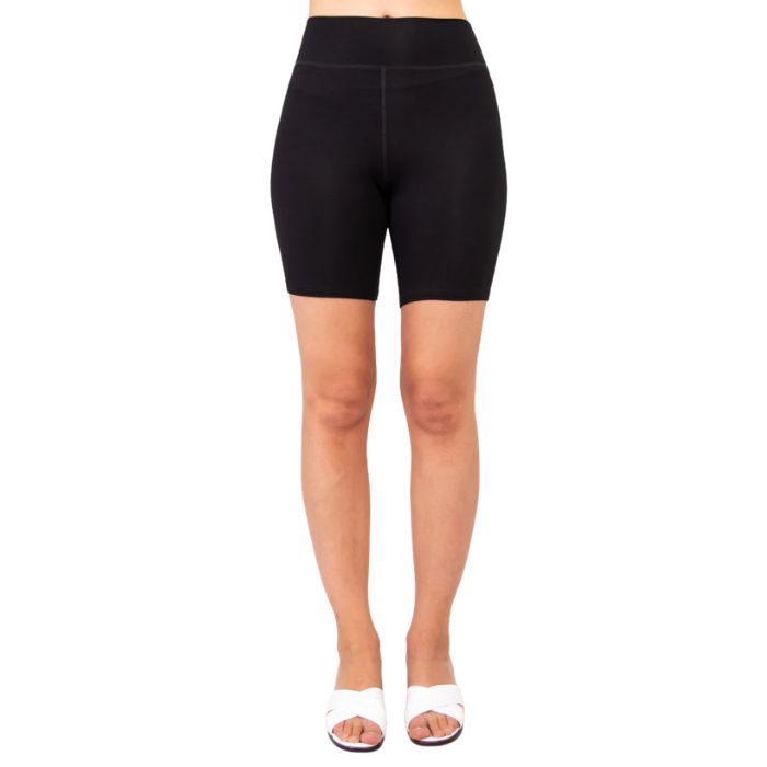 female model wearing black hallie shorts front view on white background