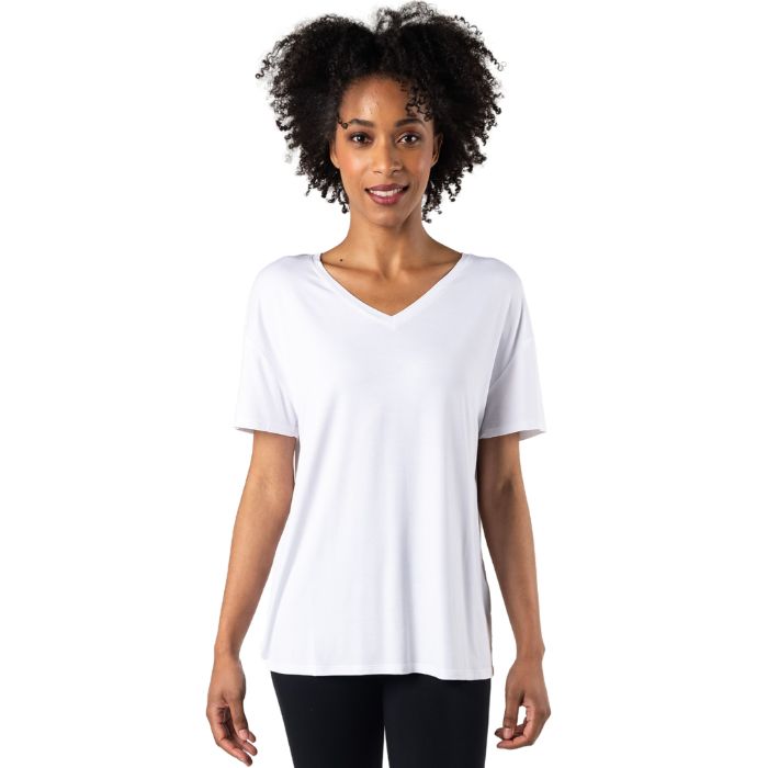 female model wearing white harper tee front view on white background