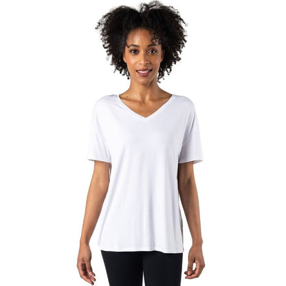 female model wearing white harper tee front view on white background