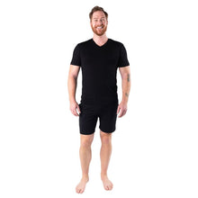 male model wearing black huron v-neck t-shirt and black aspen shorts front view on white background
