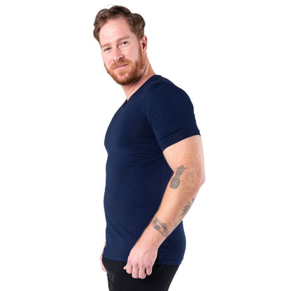 model wearing ink blue huron v-neck t-shirt side view on white background