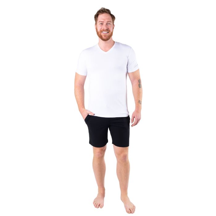 male model wearing white huron v-neck t-shirt and black aspen shorts front view on white background