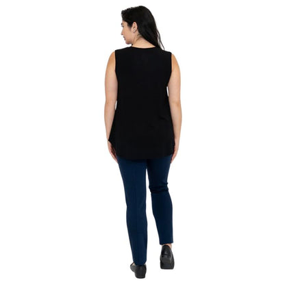 female model wearing black jackie tank top and indigo blue nadia pants back view on white backround