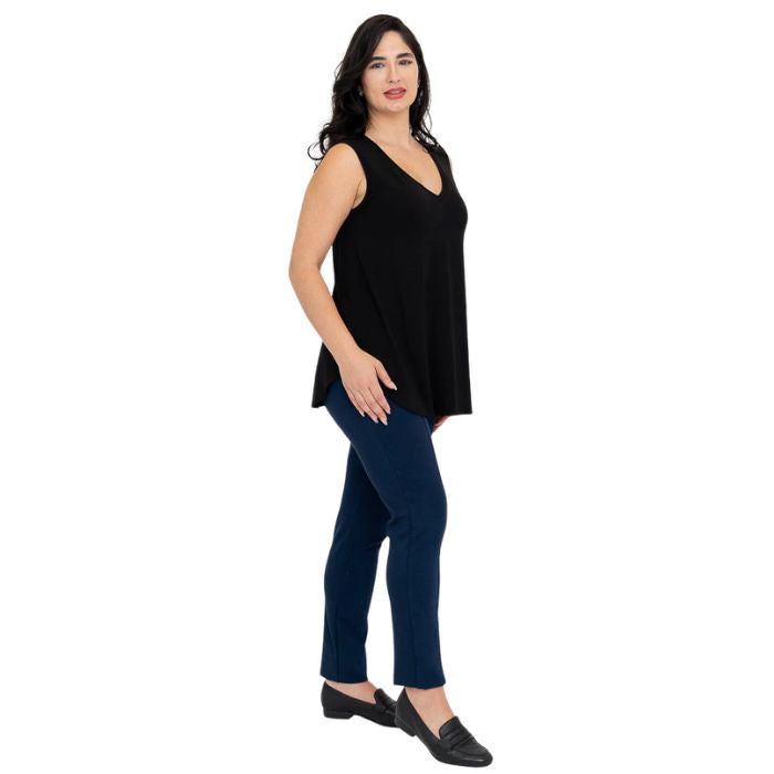 female model wearing black jackie tank top and indigo blue nadia pants side view on white backround