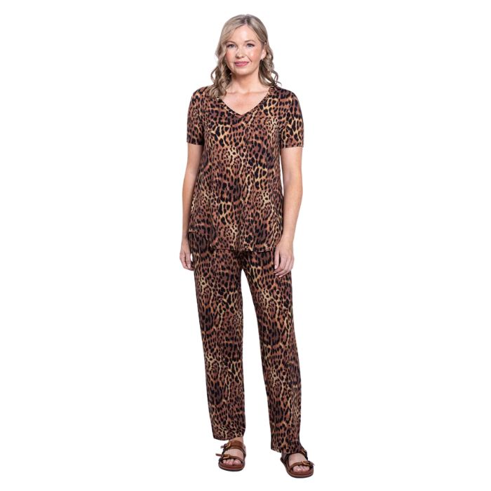 female model wearing chocolate leopard print jackie top and chocolate leopard print dream pants front view on white backround