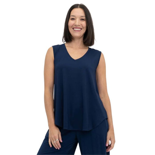 female model wearing indigo blue jackie tank top front view on white backround
