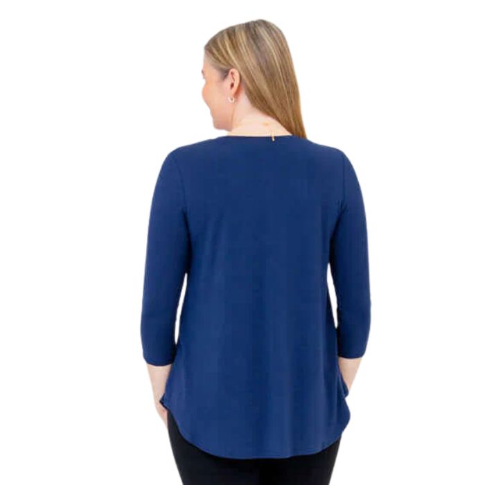 female model wearing indigo blue jackie top back view on white backround