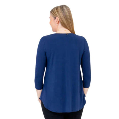 female model wearing indigo blue jackie top back view on white backround