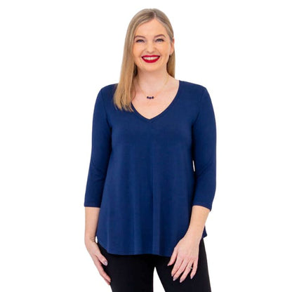 female model wearing indigo blue jackie top front view on white backround