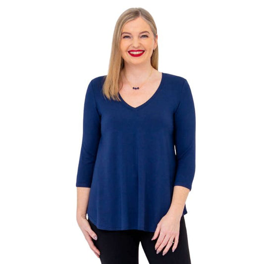 female model wearing indigo blue jackie top front view on white backround