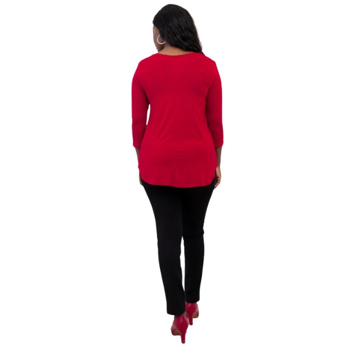 female model wearing lipstick red jackie top and black nadia pants back view on white backround