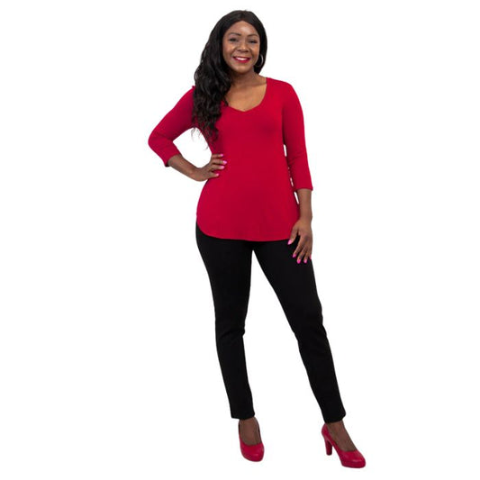 female model wearing lipstick red jackie top and black nadia pants front view on white backround