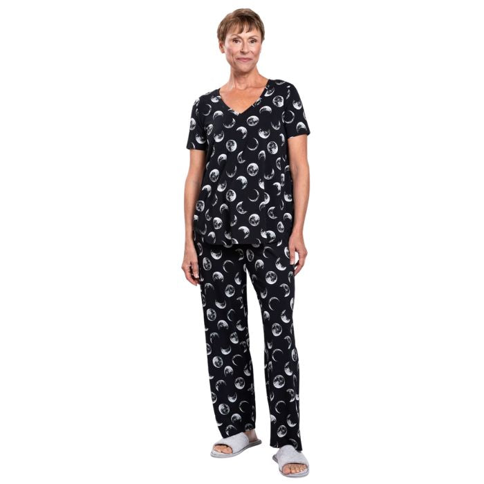 female model wearing moonstruck print jackie top and moonstruck print dream pants front view on white backround
