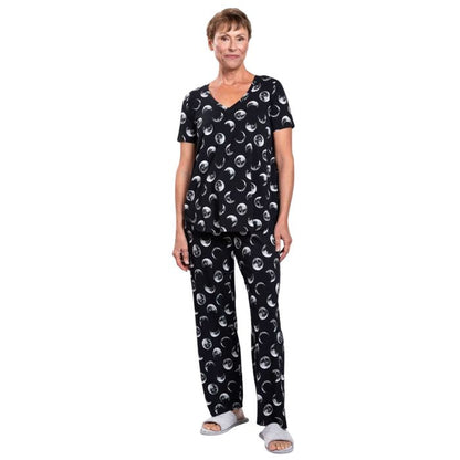 female model wearing moonstruck print jackie top and moonstruck print dream pants front view on white backround