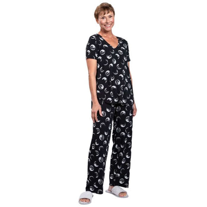 female model wearing moonstruck print jackie top and moonstruck print dream pants front view on white backround
