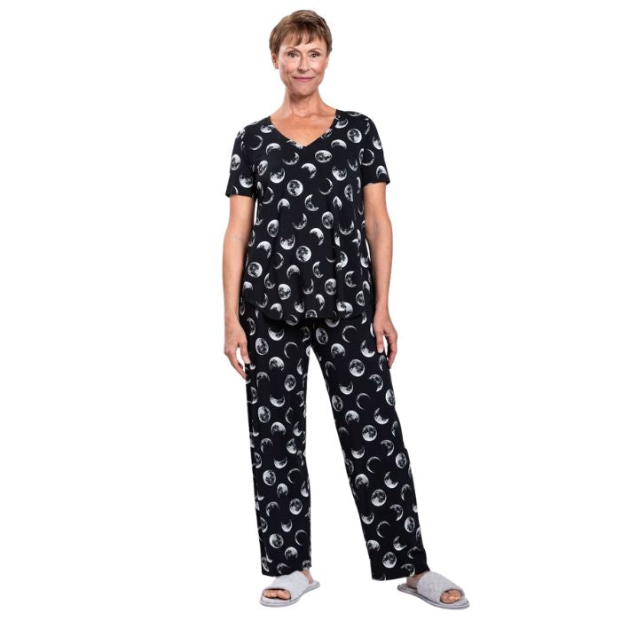 female model wearing moonstruck print jackie top and moonstruck print dream pants front view on white backround