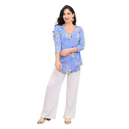female model wearing peri daisy print jackie top and white landon pants front view on white backround