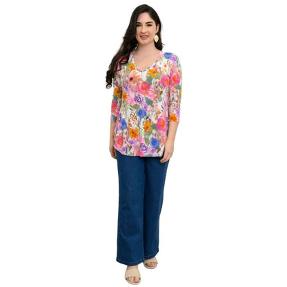 female model wearing pink bouquet print jackie top and denim blue jeans front view on white backround