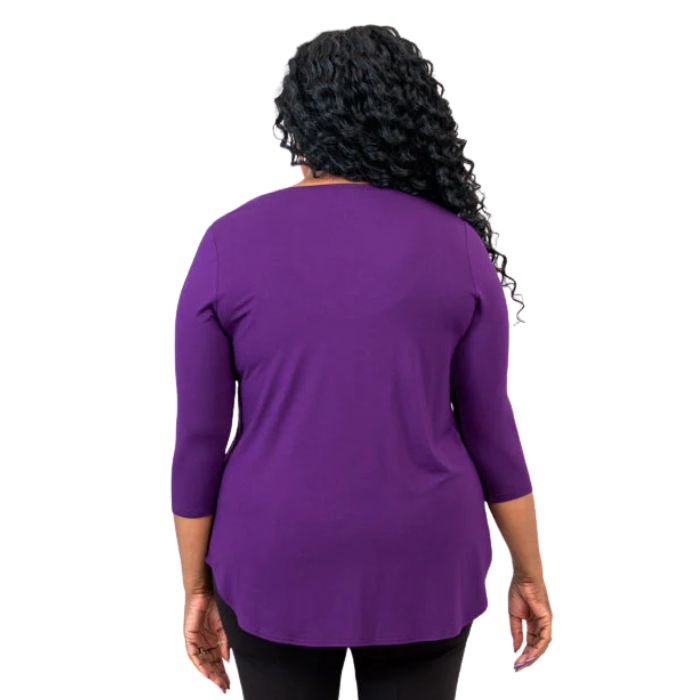 female model wearing royale purple jackie top back view on white backround