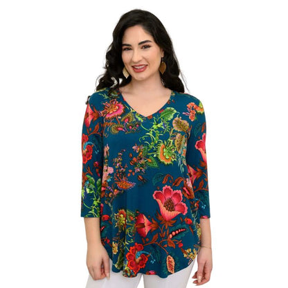 female model wearing teal fantasy print jackie top front view on white backround