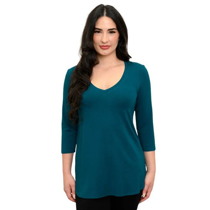 female model wearing teal green jackie top front view on white backround