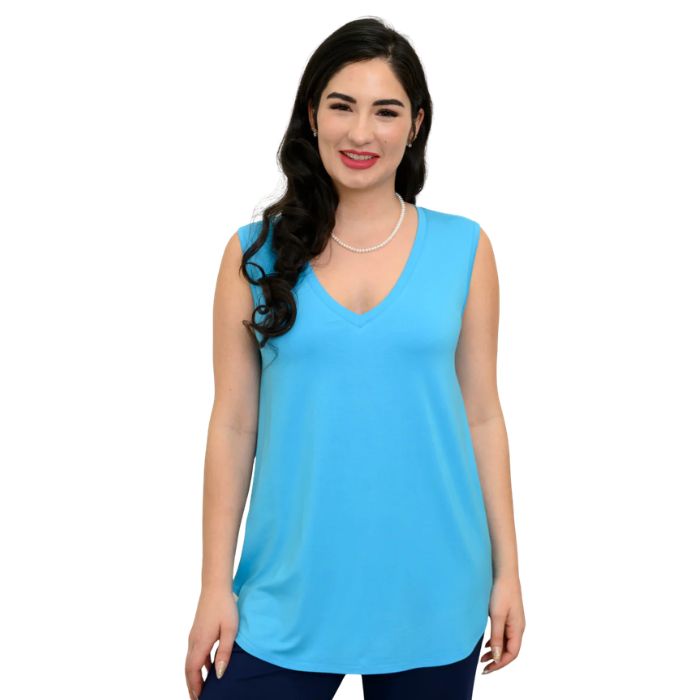 female model wearing turquoise blue jackie tank top front view on white backround