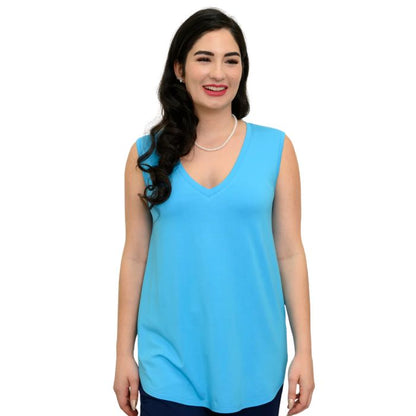 female model wearing turquoise blue jackie tank top front view on white backround