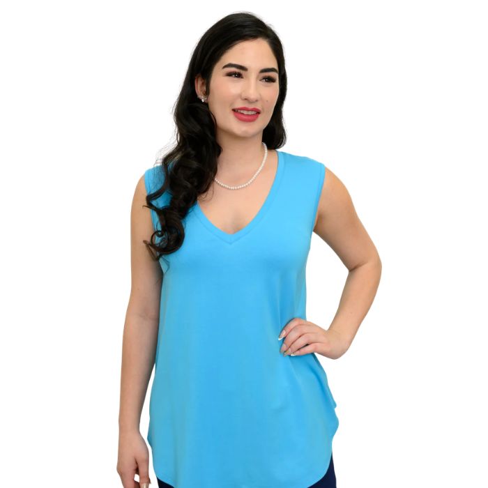 female model wearing turquoise blue jackie tank top front view on white backround