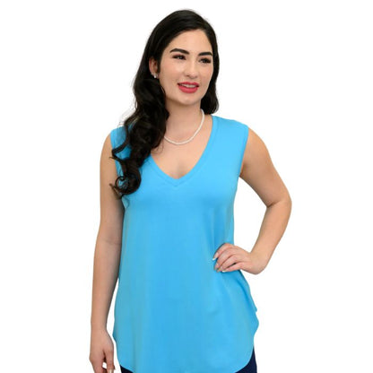 female model wearing turquoise blue jackie tank top front view on white backround