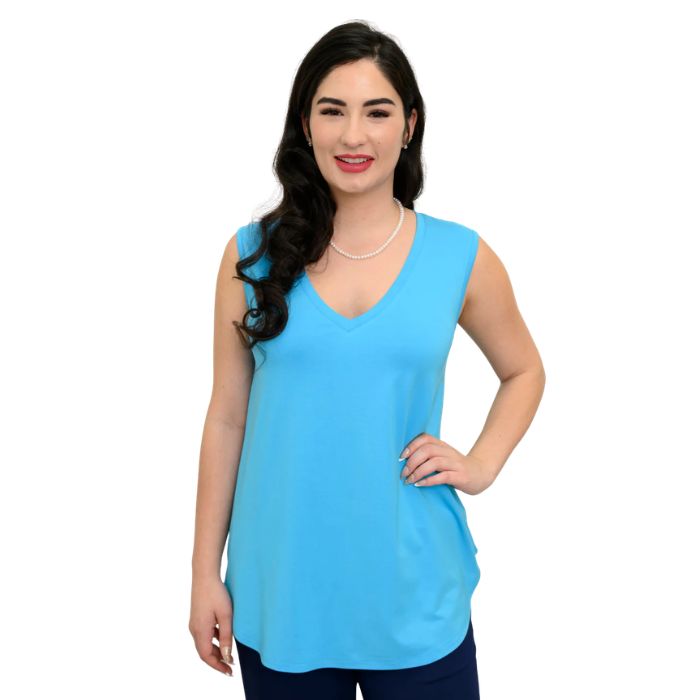 female model wearing turquoise blue jackie tank top front view on white backround