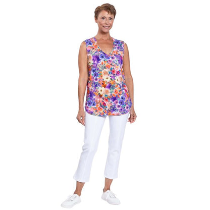 female model wearing violet fiesta print jackie tank top and white nadine cropped pants front view on white backround