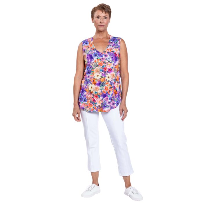 female model wearing violet fiesta print jackie tank top and white nadine cropped pants front view on white backround
