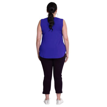 female model wearing violet purple jackie tank top and black susan capri pants back view on white backround