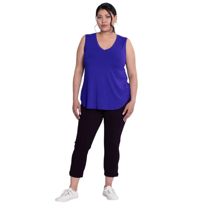 female model wearing violet purple jackie tank top and black susan capri pants front view on white backround