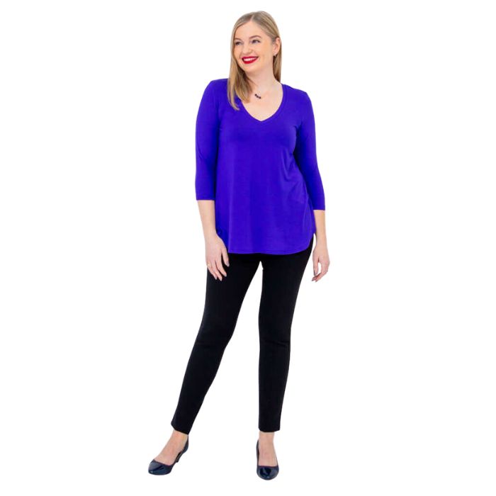 female model wearing violet purple jackie top and black nadia pants front view on white backround