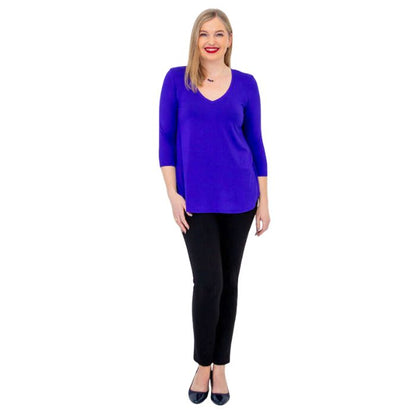 female model wearing violet purple jackie top and black nadia pants front view on white backround