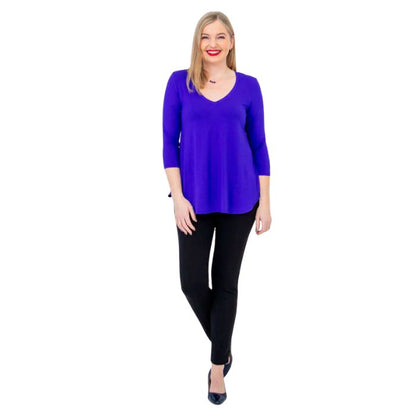 female model wearing violet purple jackie top and black nadia pants front view on white backround