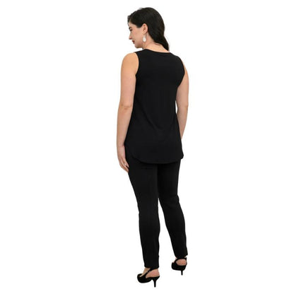 female model wearing black diamond jazz tank top and black nadia pants back view on white background