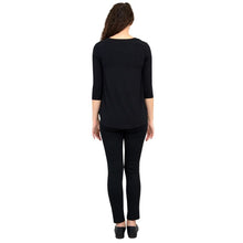 female model wearing jazz black three quarter sleeve top and nadia black pants back view on white background