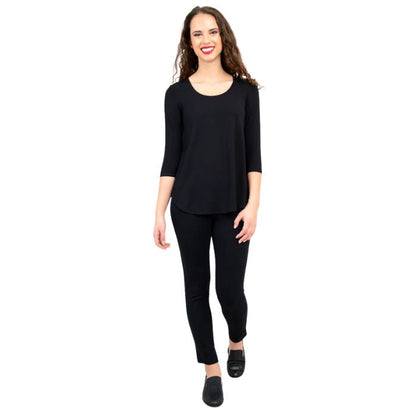 female model wearing jazz black three quarter sleeve top and nadia black pants front view on white background