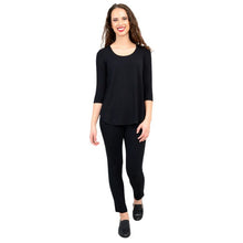 female model wearing jazz black three quarter sleeve top and nadia black pants front view on white background